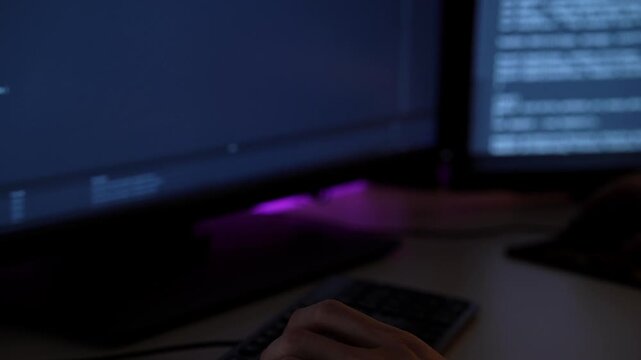 Closeup hands typing on mechanical keyboard, precise keystrokes with backlight, wrist alignment and smartwatch visible, rhythm of coding captured in low light with focused desk setup.