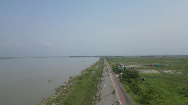 Wide drone view of Jamuna River and surrounding landscape Bangladesh 4K