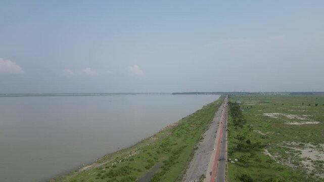 Wide drone view of Jamuna River and surrounding landscape Bangladesh 4K