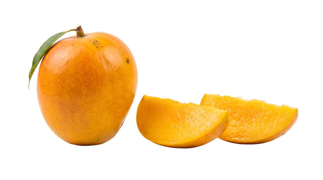 A ripe mango fruit with two slices on a plain background