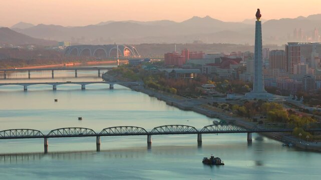 Juche Tower, Pyongyang morning panoramic view, North Korea. Taedong River in the morning fog. View facing upstream, modern residential complex. View from Yanggakdo Hotel