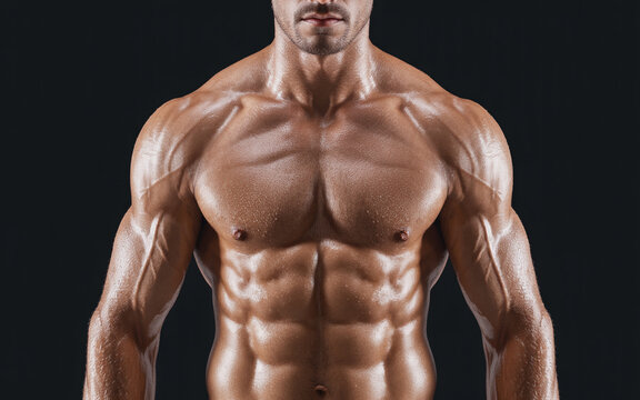 A fit male bodybuilder with highly defined abdominal muscles and sculpted chest and shoulders against a dark background