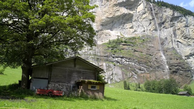 Lauterbrunnen Waterfall And Swiss Mountain Chalet - Cinematic Walking Shot
