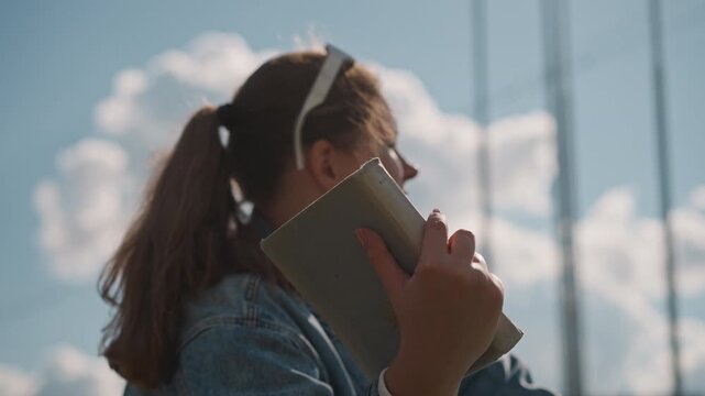 Female individuals engaging with natural surroundings. Women immersed in beauty of seaside landscape. Multiple women appreciating tranquility of coastal environment through reading and gazing