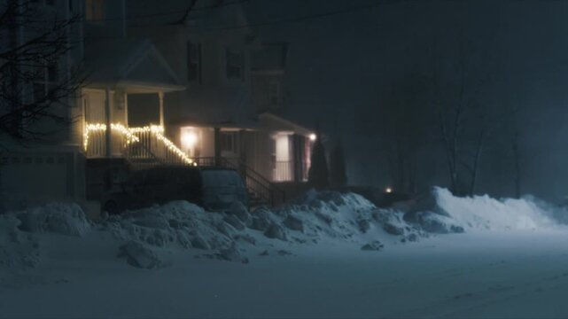 A powerful snow storm sweeps through Beachville, Nova Scotia, painting the streets white. Blustery winds whip snow into drifts, obstructing paths and illuminating the quiet winter night