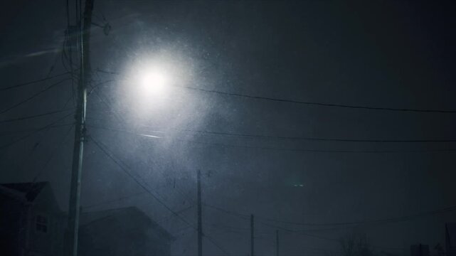 A fierce snow storm envelops Beachville, Nova Scotia, creating heavy snowdrifts and strong winds. The scene captures the challenges of navigating through the winter night in Canada
