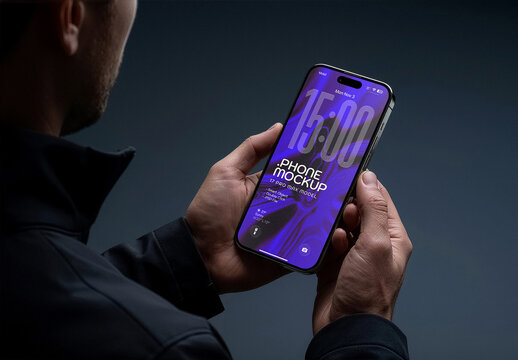 Smartphone Mockup Hand Held By Man In Dark Studio