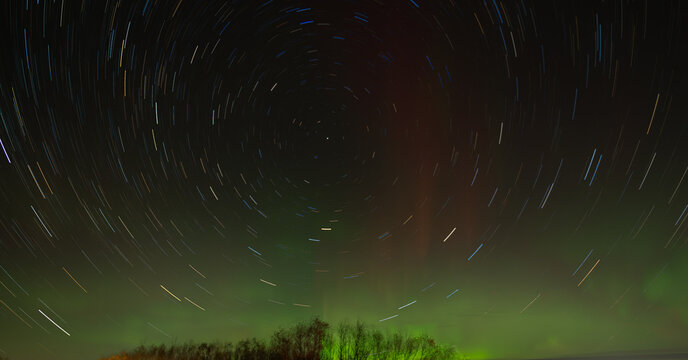 Star trails with northern lights in the background