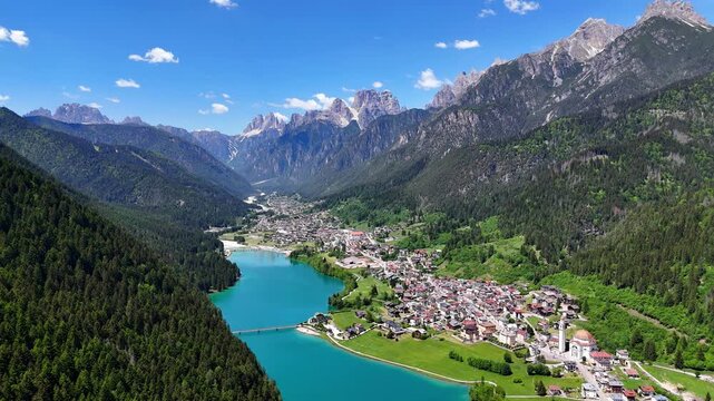 Aerial drone view of Lago di Auronzo, also known as Lake Santa Caterina, in the Dolomites. Belluno, Italy.