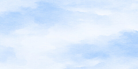 Soft watercolor-style clouds drift across a pale blue sky, creating a serene and dreamy atmosphere perfect for background use. © jaduuu
