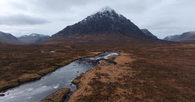 Aerial footage of the Iconic Glencoe bridge over river Etive on a mountain background