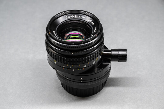 Gothenburg, Sweden - October 13 2023: Nikon PC Nikkor 35mm f2.8 tilt shift lens angled product shot on light background.
