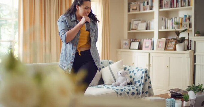 Singing, dancing and woman with remote in home for good mood, positive energy and karaoke. Happy, living room and person with lyrics for music, audio and playlist for groove, moves and fun on weekend