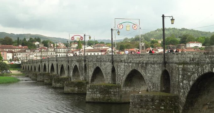 the famous Ponte de Lima (also known as Ponte Romana e Medieval) in the city of the same name in Portugal. It crosses the Lima River and is considered one of the most important landmarks of the Minho 