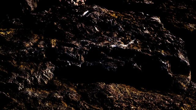 Abstract Dark Brown Rocky Texture Background with Earth Mineral Elements and Copy Space for Text