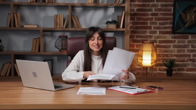 Business woman discusses important documents and shows frustration.
