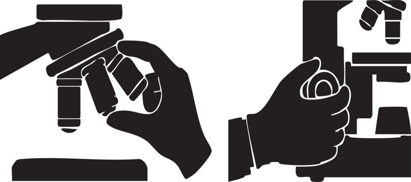 Close up silhouette of a laboratory researcher's hand manually turning the fine focus adjustment knob of a microscope