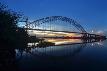 Fototapeta premium A bridge in South Kalimantan, Indonesia, at sunset.