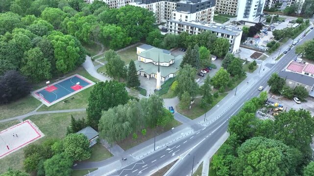 Aerial LDS Church in city park Warsaw Poland 4K. Chapel the Church of Jesus Christ of Latter-day Saints. City center park. Religious headquarters. Royal Capital City of Warsaw in northern Poland.