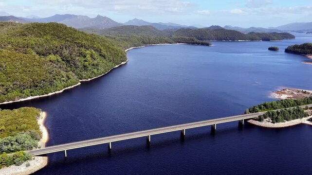 Highway Bradshaw bridge across Burbury lake near Queenstown in Tasmania &ndash; aerial.