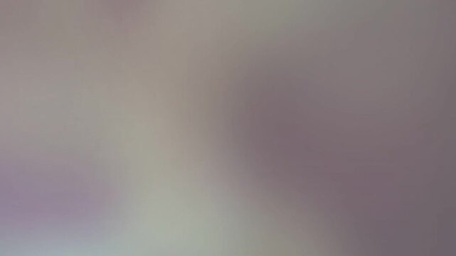 A soft gradient of muted purple and pale yellow hues blends seamlessly across the frame, creating an ethereal, atmospheric, and tranquil visual texture that evokes a sense of peace and serenity.