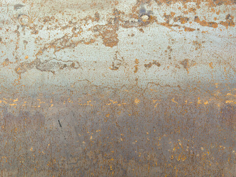 Scratched rusty industrial metal plate backdrop