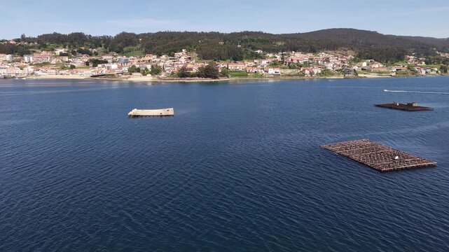 Mussel rafts dotting the waters of ria de pontevedra, a key aquaculture area in galicia