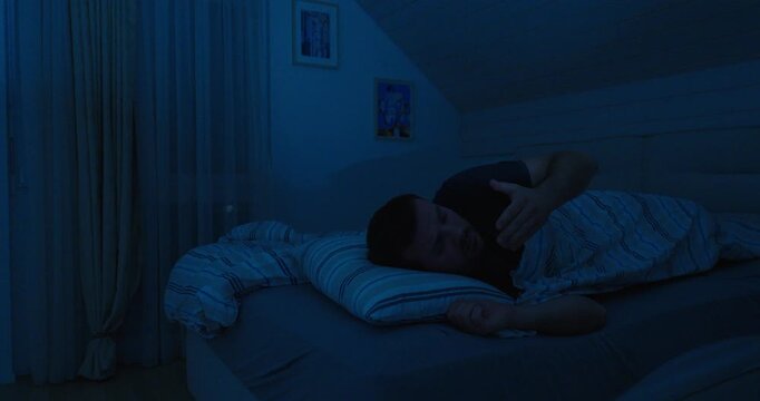 Man Waking Up at Night and Opening Window Due to Heat