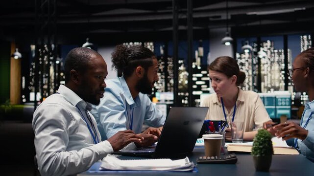 Business manager leading multiracial team, fostering teamwork and positive office culture. Management executive in boardroom supervising administrative staff, delegating tasks and reviewing KPIs.