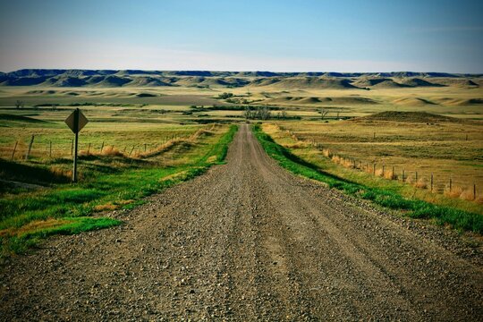 A lonely dirt road wanders through Eastern Montana