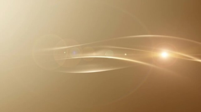 Golden abstract light lines flowing on warm background with lens flare.