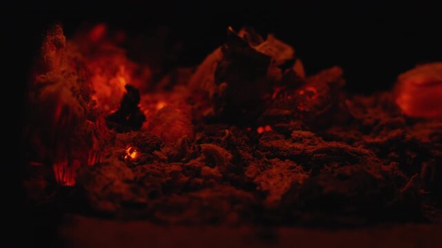 Macro closeup molten miniature volcanic landscape, fiery orangered lava pockets and glowing scoria, ash ridges and gritty terrain, deep cinematic shadows and tactile detail, intense heat impression