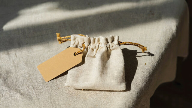 mockup of cotton drawstring pouch with empty white tag.ai 