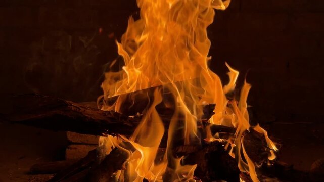 Glowing fire close‑up while celebrating Eid with barbecue outdoors.