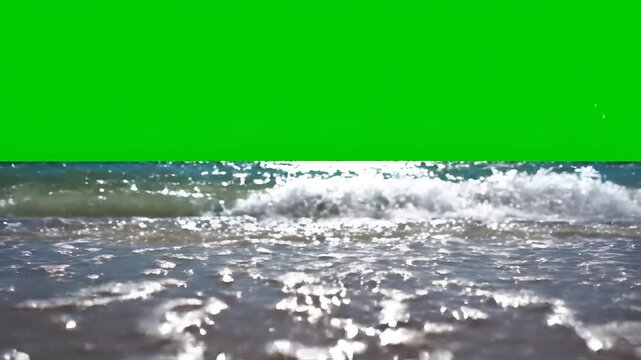 Ocean Waves Crashing on Sandy Beach with Green Screen Background.