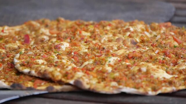 Delicious flatbread with savory topping is baked fresh