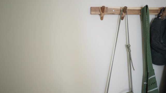 Umbrella and accessories hanging on a wall rack