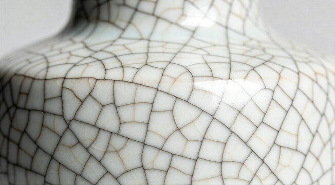 Macro detail of white crackle glaze on ceramic porcelain with antique texture and crazing pattern