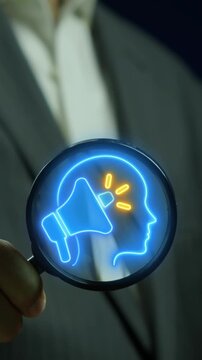 Public Relations concept, the practice of managing and disseminating information from an individual or an organization to the public. Megaphone icon and human head on magnifying glass.