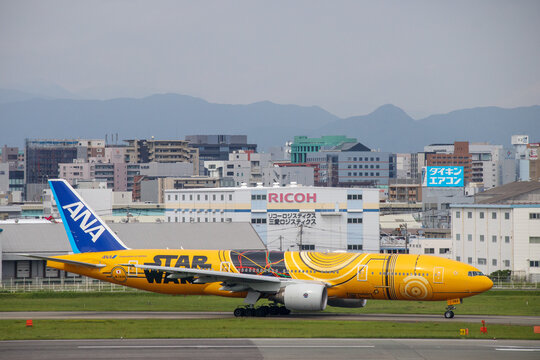 Fukuoka, Japan - July 10, 2019: An ANA All Nippon Airways Boeing 777-200ER (Registration JA743A) in special "C-3PO STAR WARS" livery taxiing at Fukuoka Airport.