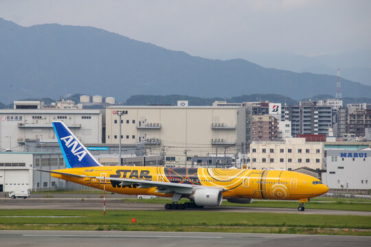 Fukuoka, Japan - July 10, 2019: An ANA All Nippon Airways Boeing 777-200ER (Registration JA743A) in special "C-3PO STAR WARS" livery taxiing at Fukuoka Airport.
