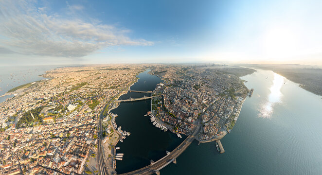 Istanbul, Turkey. Panoramic aerial view over Golden Horn with Galata Bridge and Halic Metro Bridge, Bosphorus meeting Sea of Marmara. Aerial view