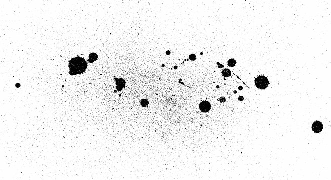 Ink spots on white paper surface.