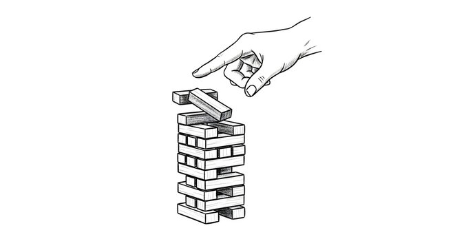 Hand placing last block on unstable wooden tower.