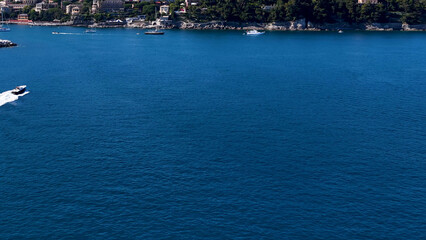 Naklejka premium Aerial View of a Speedboat Cruising the Deep Blue Mediterranean Sea