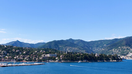 Fototapeta premium Panoramic View of an Italian Coastal Town and Harbor in Liguria