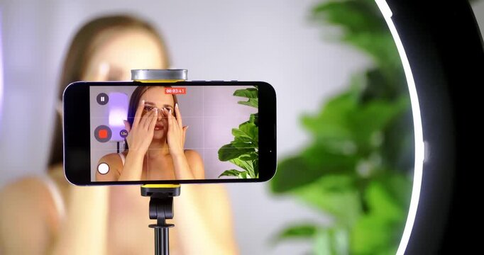 Influencer Records Skincare Tutorial with Smartphone