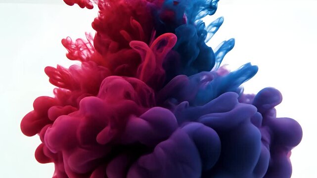 Abstract Red and Blue Ink Cloud Explosion in Water.
