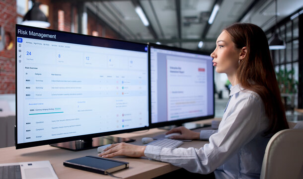 Woman Analyzing Financial Data On Computer