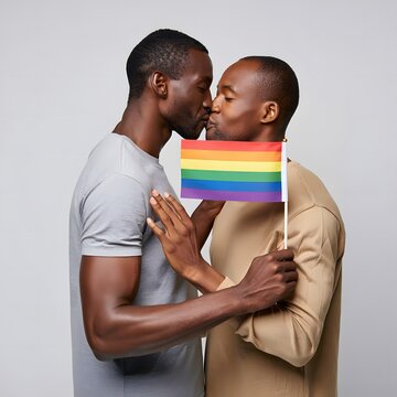 Two Men Embracing with Pride Flag in Romantic and Joyful Moment